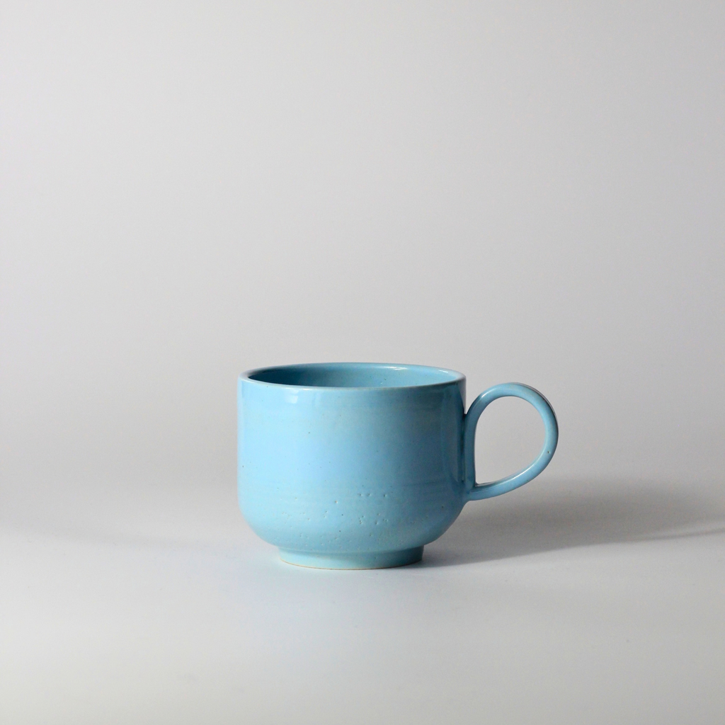 Blå mugg med öra